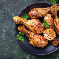 Grilled chicken legs with spices and garlic. Top view