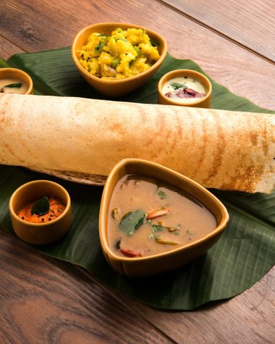 Masala dosa is a South Indian meal served with sambhar and coconut chutney. Selective focus